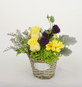 Small basket arrangement in yellow, purple and green