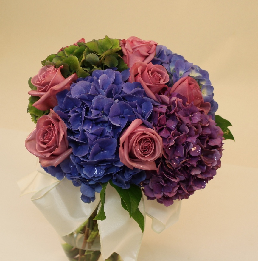 Handtied bouquet for the Bride in purple blue and mauve