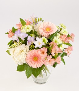 Creamsicle colours in a pretty vase arrangement