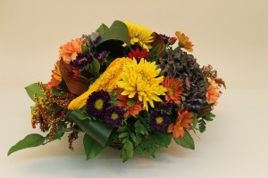 Mums, asters, carnations in fall arrangement