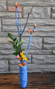 Yarn on vase and branches