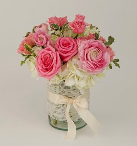 Pink and white vase arrangement with ranunculus and roses