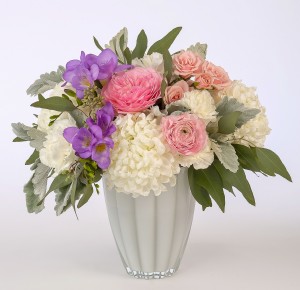 Pink, mauve and white design in a white glass vase